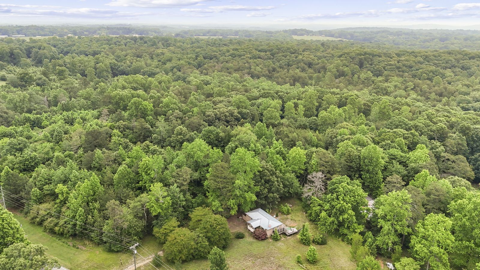 Aerial view of 4454 Ledan Ext, Gainesville GA, the estate and its acreage